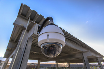White dome security camera in business lot