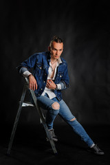 Fototapeta premium Young handsome man in jeans