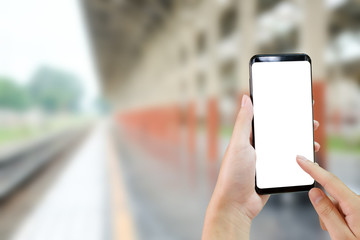 Mock up smartphone in train station.