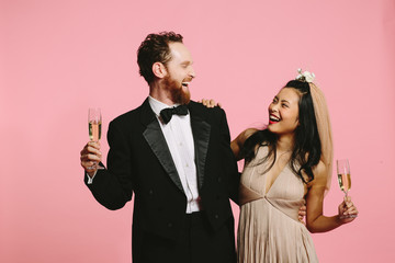 Happy bride and groom having a good laugh