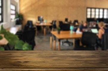 Selected focus empty brown wooden table in office with big windows of the Background with bokeh image. for your photomontage or product display