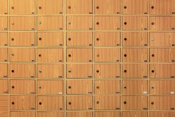Wooden locker boxes, with metal locks in the post office.