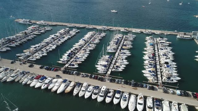 Aerial footage of marina with fishing boats and recreational vessels in Biograd, a popular holiday destination along the Croatian coast