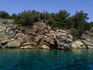 Stone shore of Cleopatra island, Turkey island in the mediterranian sea