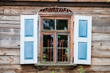 Fototapeta na wymiar Window with shutters of the old house