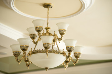 Vintage luxury chandelier in antique style in elegant interior closeup