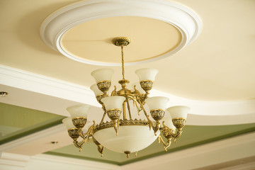 Fototapeta na wymiar Vintage luxury chandelier in antique style in elegant interior closeup