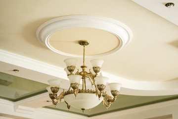 Vintage luxury chandelier in antique style in elegant interior closeup