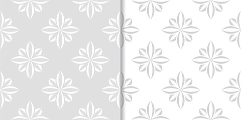 Light gray floral ornaments. Set of seamless patterns