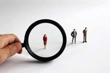 The concept of discriminatory selection criteria for women in corporate recruitment. Magnifier and...