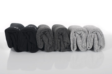 male socks twisted into rolls and folded in a row