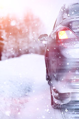 The car stands on a snow-covered road