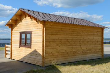 Obraz premium small wooden house in the city street