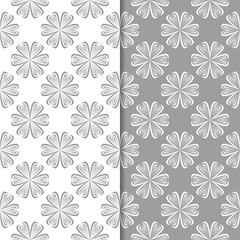 White and gray floral backgrounds. Set of seamless patterns