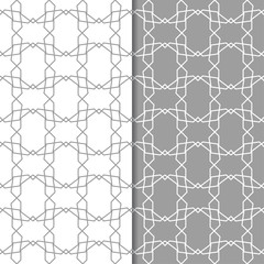 Gray and white geometric ornaments. Set of seamless patterns