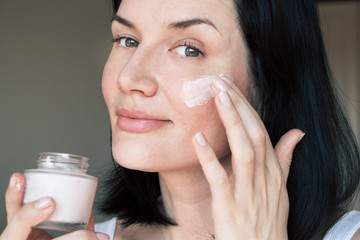 girl doing morning facial treatment