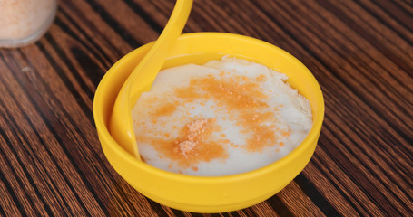 Adding sugar on tofu pudding