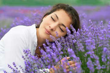 young woman is in the lavender field, beautiful portrait, face closeup, summer landscape with red...