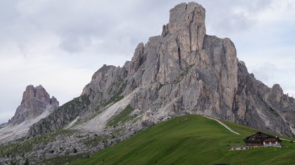 House at the foot of one of the mountain peaks of the Dolomites of Italy © Tanya