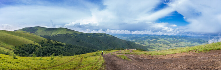 Fototapeta na wymiar Mountain range clouds panoramic landscape.