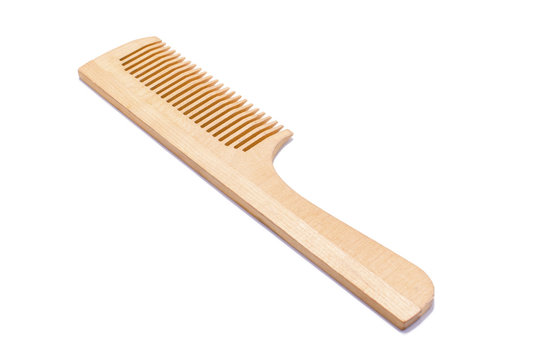 Photo of a wooden comb for hair on a white background