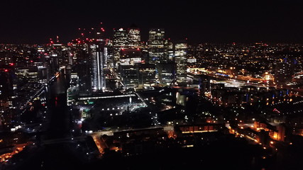 Aerial bird's eye view photo taken by drone of famous Canary Wharf skyscraper complex, Isle of Dogs, London, United Kingdom
