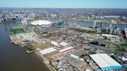 Aerial drone bird's eye view from iconic O2 Arena near isle of Dogs as seen from Greenwich, London,...