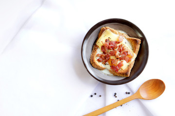 Bacon and eggs on bread.