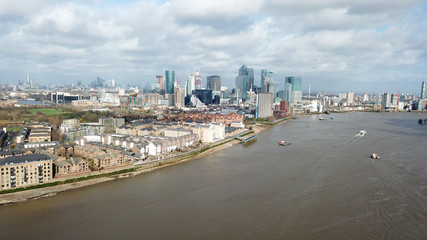 Aerial bird's eye view photo taken by drone of famous Docklands and Canary Wharf skyscraper complex, Isle of Dogs, London, United Kingdom