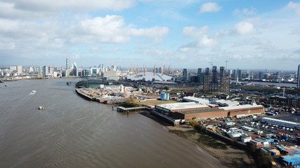 Aerial drone bird's eye view from iconic O2 Arena near isle of Dogs as seen from Greenwich, London,...
