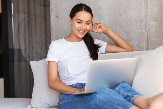 Attractive young asian woman using laptop computer