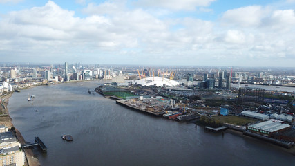Obraz premium Aerial drone bird's eye view from iconic O2 Arena near isle of Dogs as seen from Greenwich, London, United Kingdom