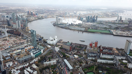 Fototapeta na wymiar Aerial bird's eye view photo taken by drone of famous Docklands and Canary Wharf skyscraper complex, Isle of Dogs, London, United Kingdom