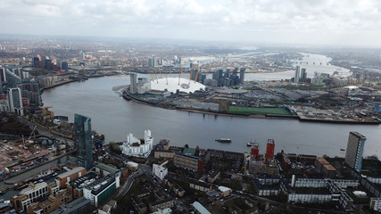 Aerial bird's eye view photo taken by drone of famous Docklands and Canary Wharf skyscraper...
