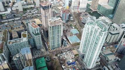 Aerial bird's eye view photo taken by drone of famous Docklands and Canary Wharf skyscraper...