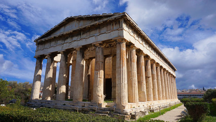Obraz premium Beautiful blue clouds and iconic Temple of Hephaestus one of the best preserved temples in Greece, Ancient Agora, Athens historic center, Attica, Greece