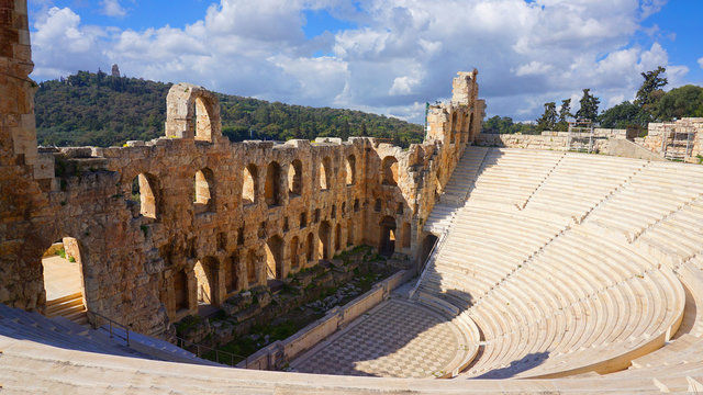 Blue sky with beautiful scattered clouds in ancient theater of Herodus Atticus, Acropolis hill, Athens historic center, Attica, Greece