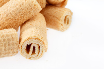 Wafer rolls. Gtoup of tasty crispy tube wafer on white background. Dessert