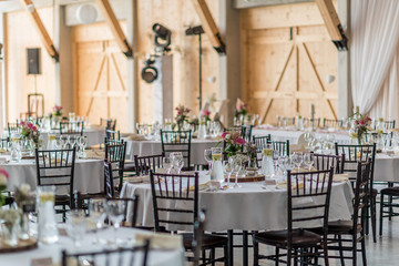 wedding table set up decoration with flowers and glasses