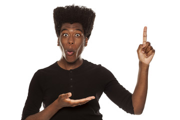 young handsome afro american guy stylish hipster pointing up happy isolated on white background....