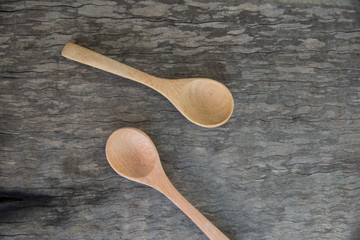 Spoon wood on wooden texture.