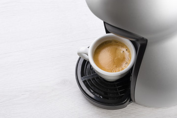 cup of coffee just filled on the machine