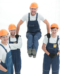 construction worker sitting on the shoulders of colleagues