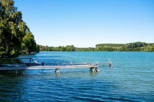 Jetty at Lake Pilsensee in Bavaria, Germany on a sunny day