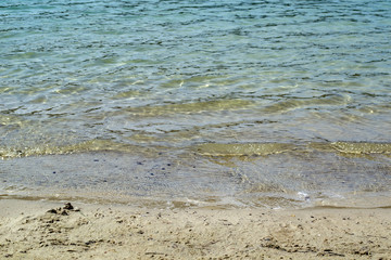 Azure coast. Clean water. Summer beach in sunshine.