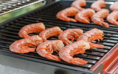 Shrimps. Cooking fresh tiger prawns on the grill. Selective focus