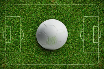 Composite image of white leather football with grass stains