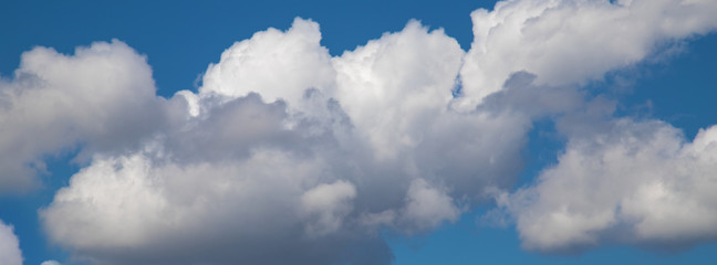 white clouds against a blue sky
