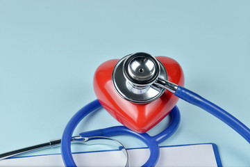 Stethoscope and red heart on blue background, Heart Check.Concept healthcare.