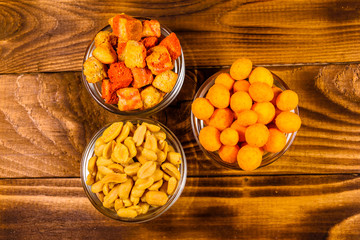Different snacks for beer on wooden table. Top view